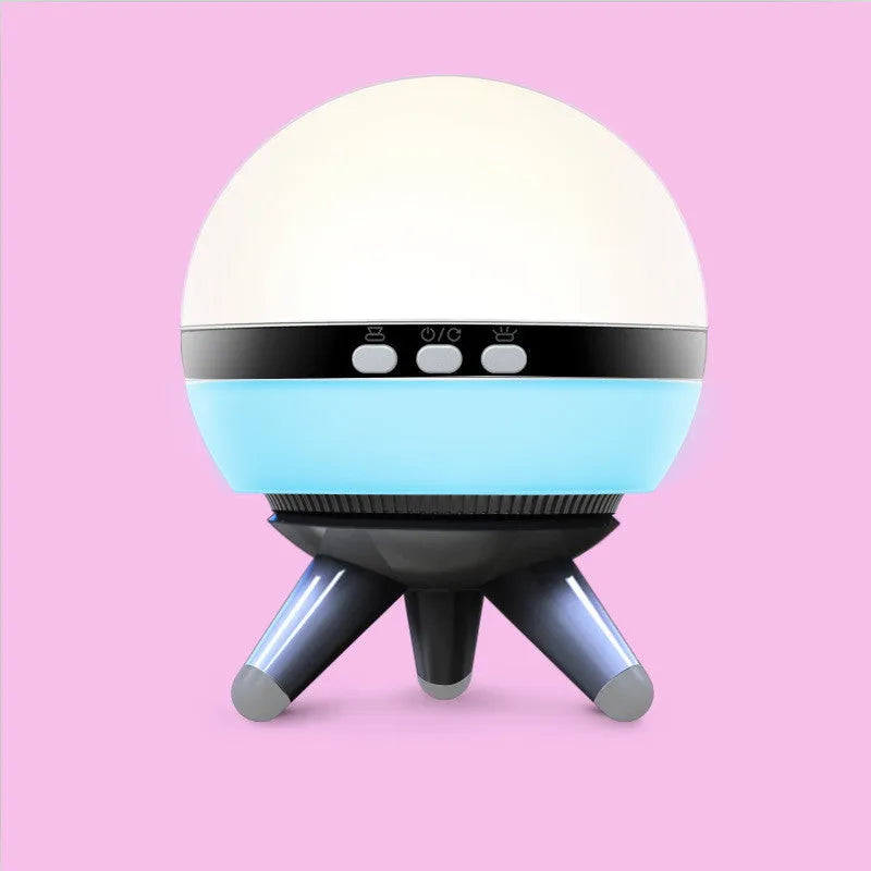 Black and white rotating cartoon-style starlight projection lamp on a surface.