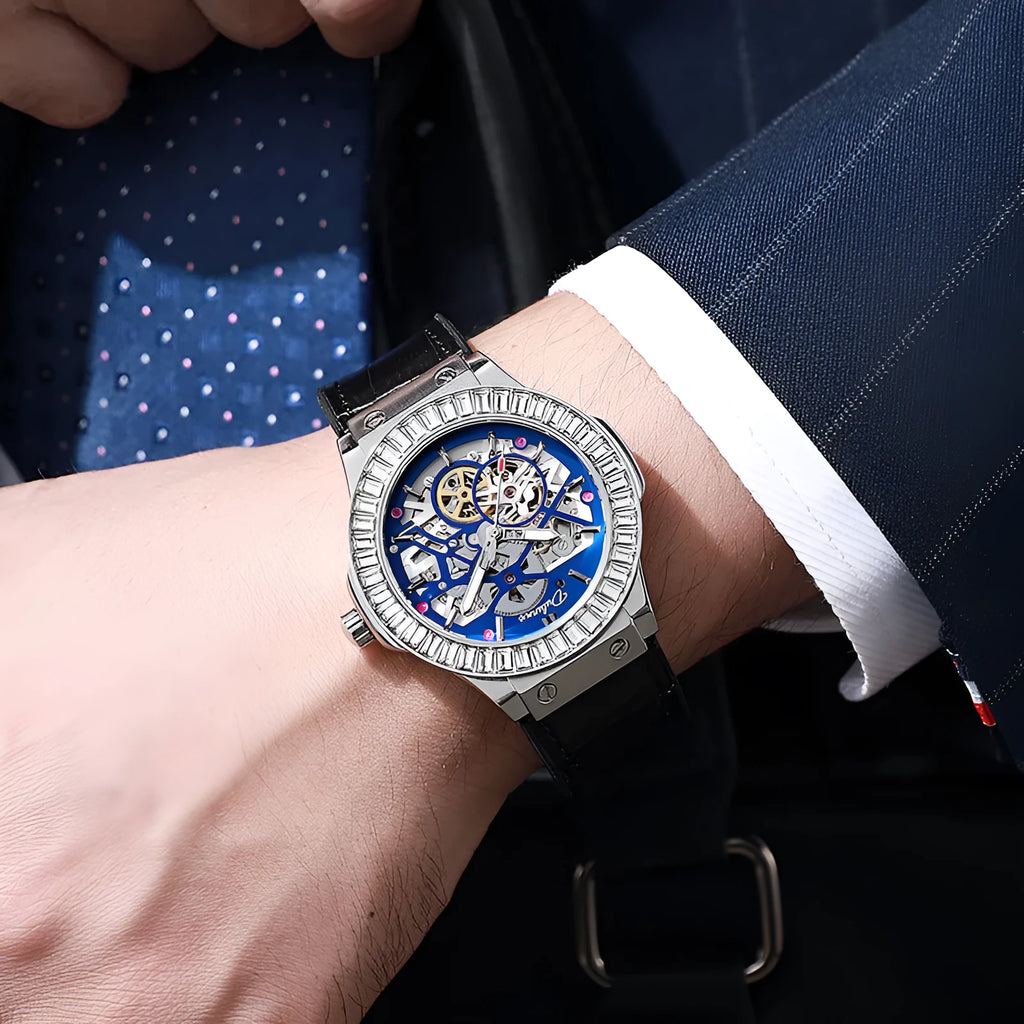 Men's automatic skeleton watch with diamond accents on a white metal case and strap.
