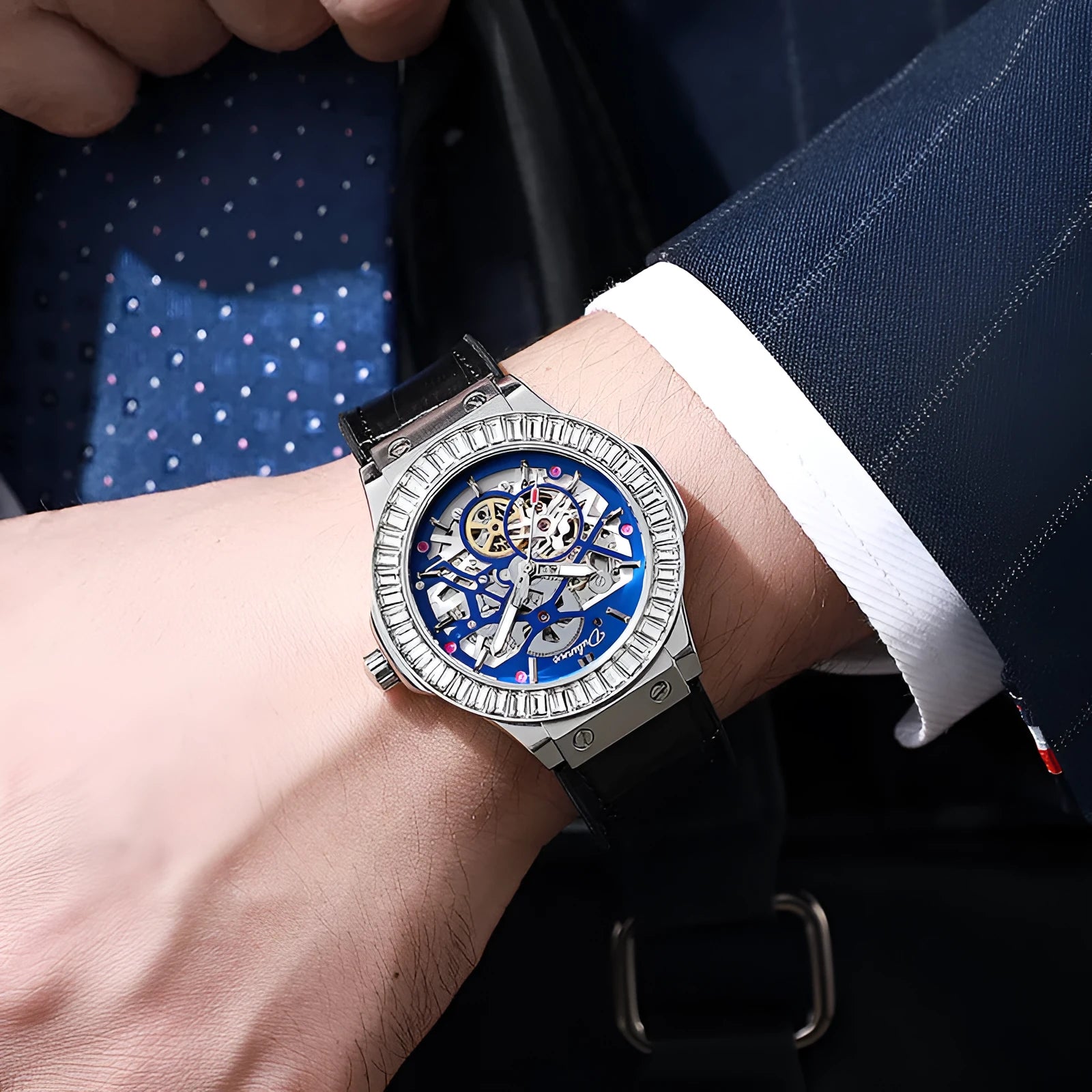 Men's automatic skeleton watch with diamond accents on a white metal case and strap.
