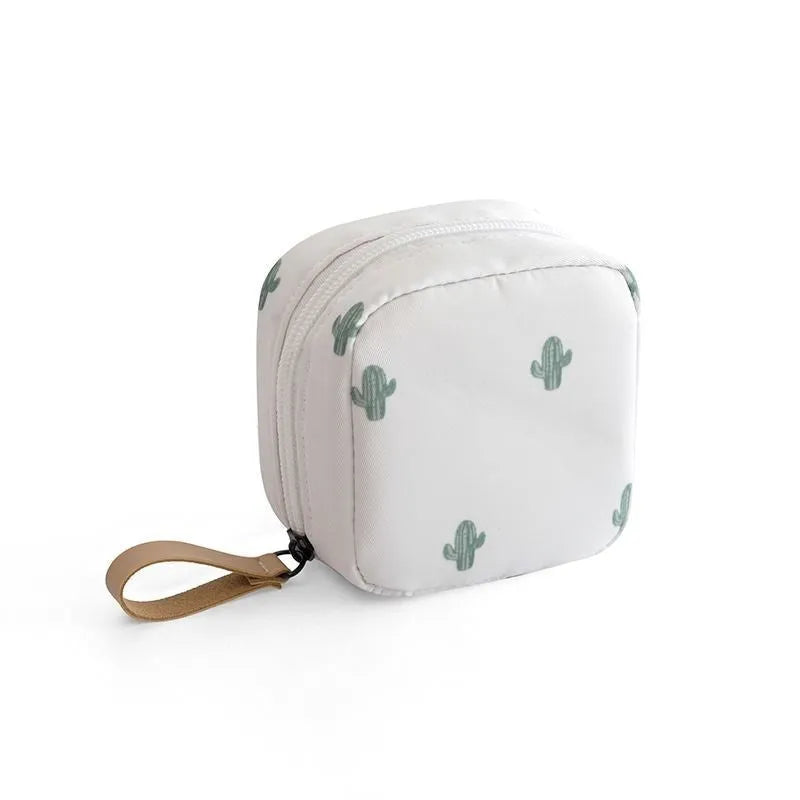 Cloth cube-shaped makeup storage bag in a plain colour on a neutral background.