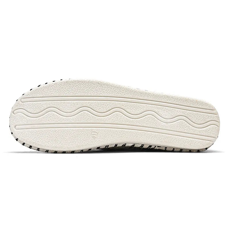 Men's beige and black cloth casual shoes with round toe and colour-block pattern, side view.
