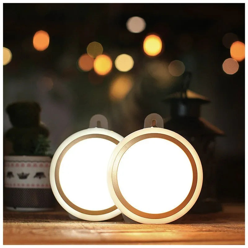 Smart round motion sensor LED light with white housing, shown mounted on a wall.