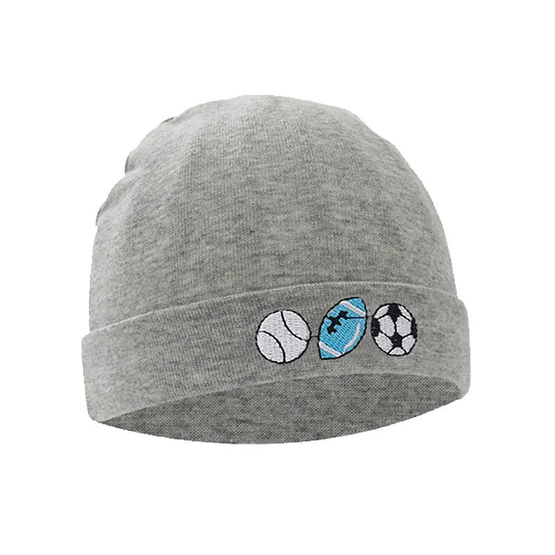Set of white, light blue, and grey cotton baby pullover caps, gloves, and foot covers for infants.