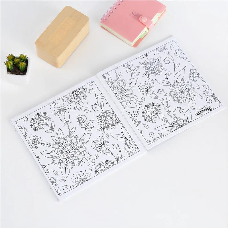 Square 21cm mandala colouring book with soft cover binder binding, shown open to a detailed pattern.