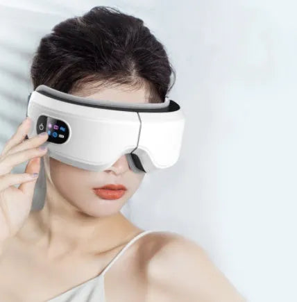 White eye massager with 16D airbag system, hot compress, and Bluetooth music for migraine relief