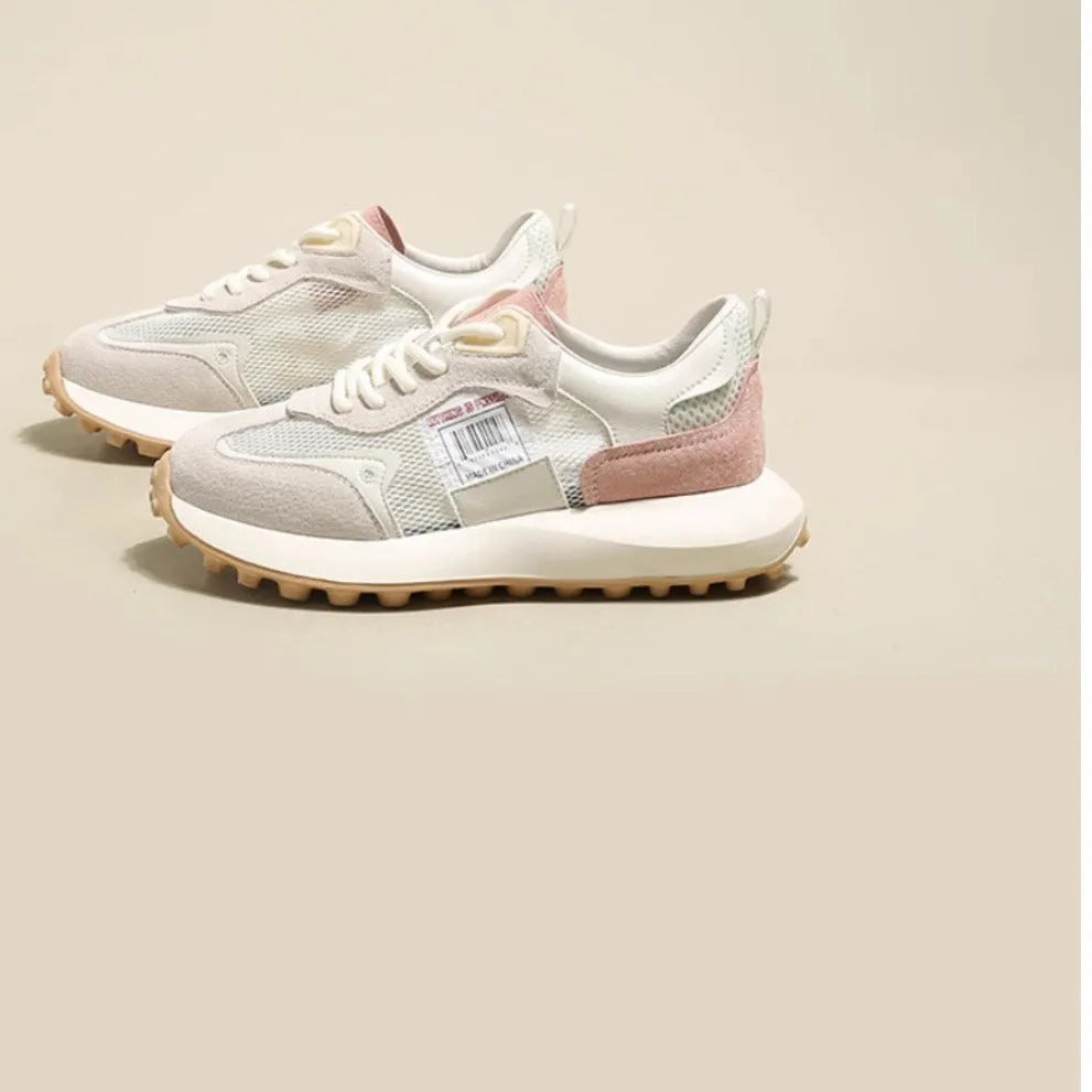 Women's grey and pink retro sneakers with low-top design and rubber soles