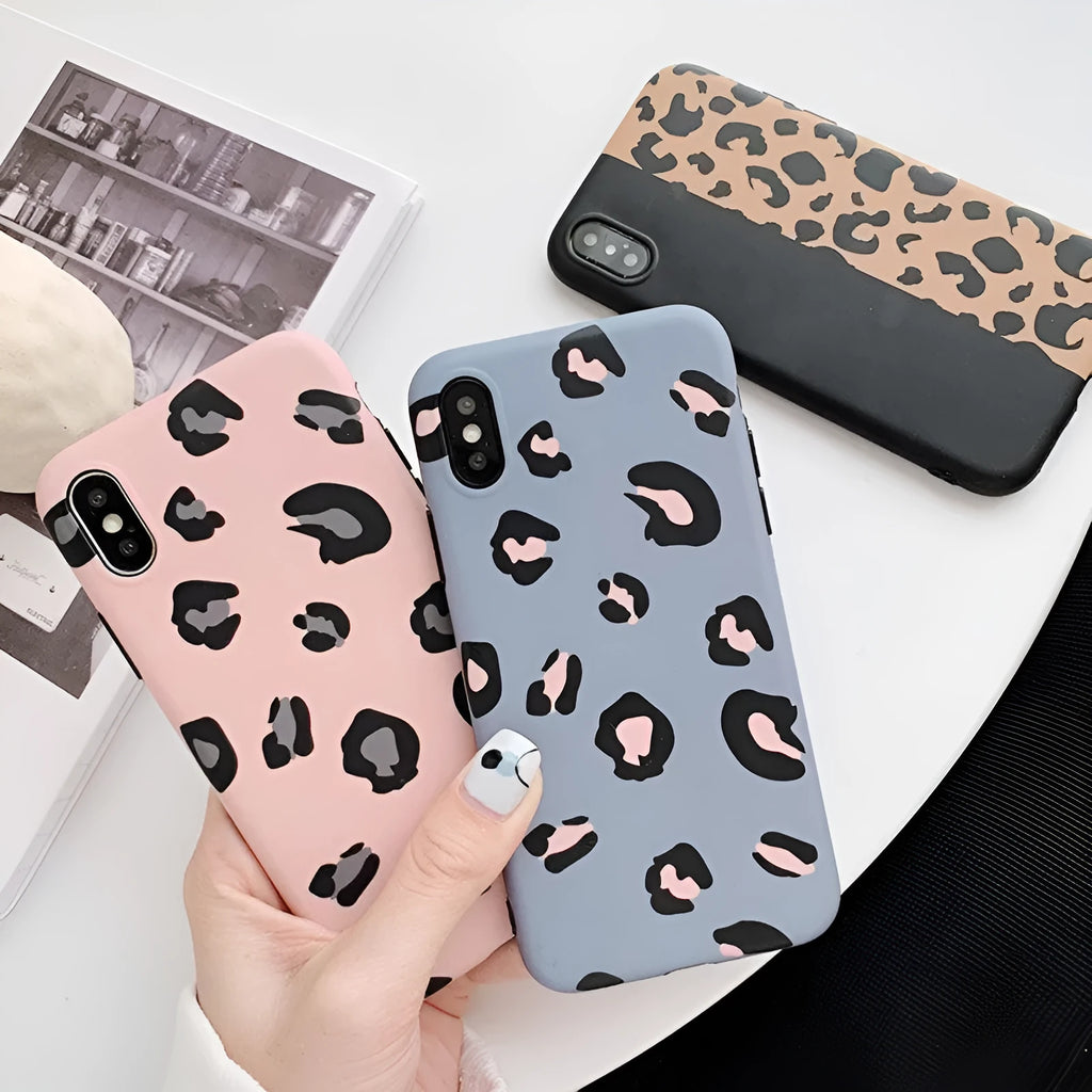 Leopard print protective mobile phone case for iPhone in black, blue, and pink colour options.