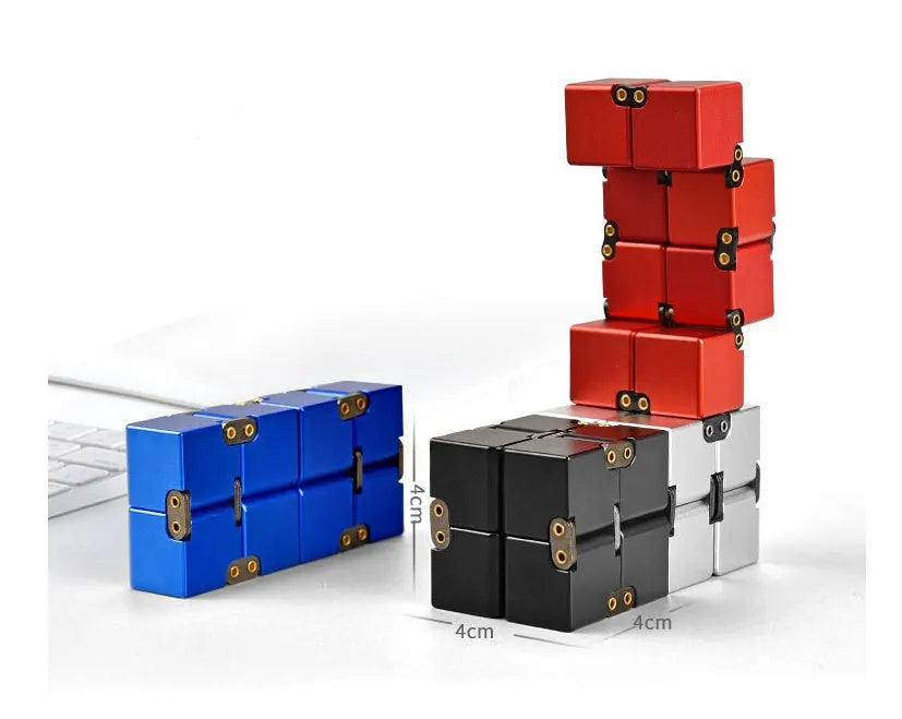 Black zinc alloy infinity cube fidget toy showing rotated cubes, on a white background.