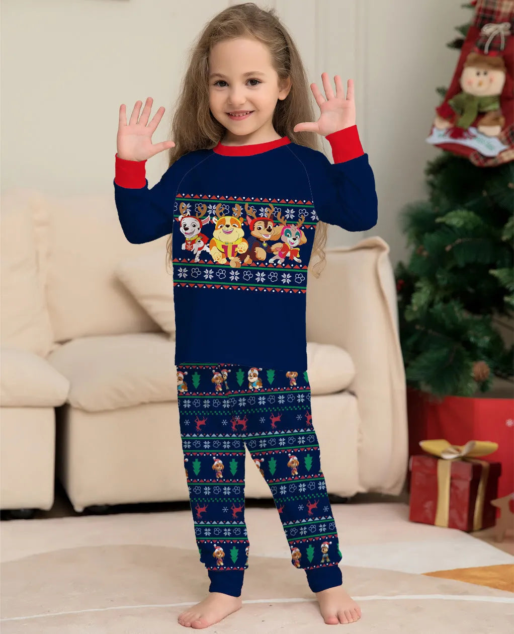 Matching red plaid Christmas pyjamas with cartoon deer print for men, women, kids, and dogs on a mannequin.