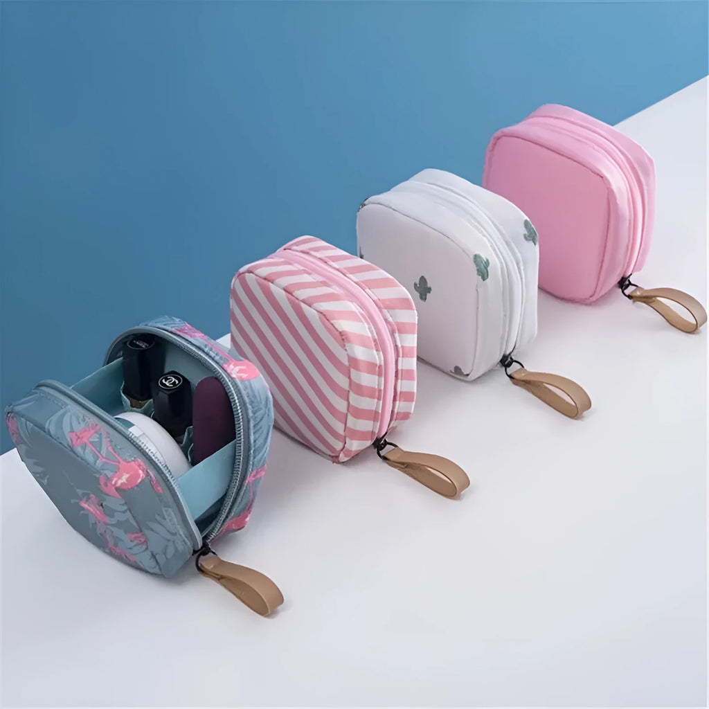 Cloth cube-shaped makeup storage bag in a plain colour on a neutral background.