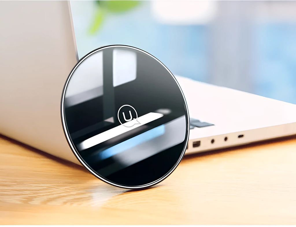 Black glass disc wireless charger with LED indicator light on smooth surface