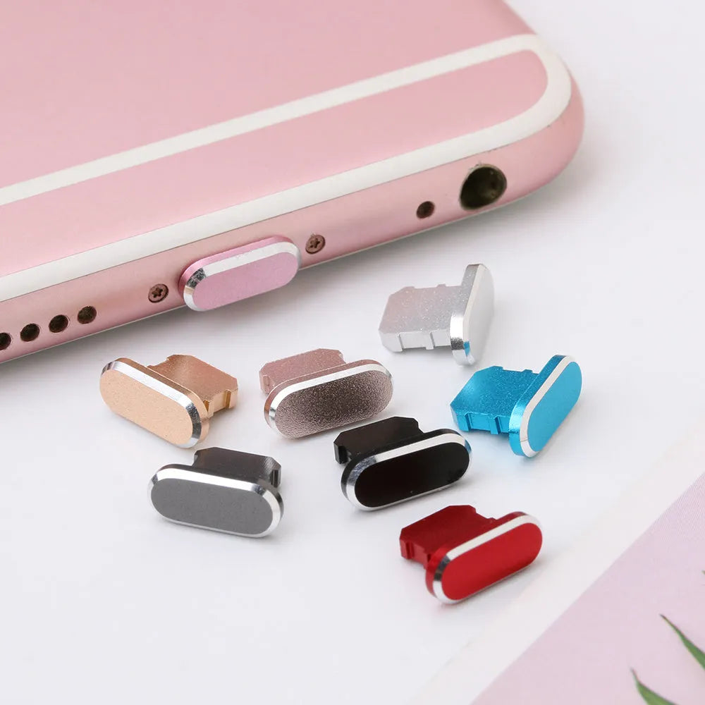 Aluminium alloy charging port dust plug for iPhone in various metallic colours including gold and rose gold.