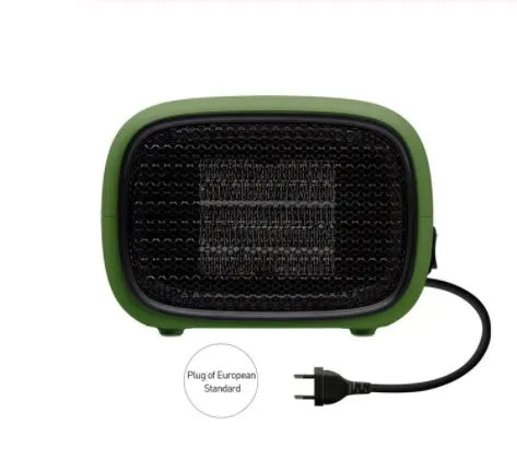 Compact green mini ceramic heater on a desktop showing its small size and EU plug.