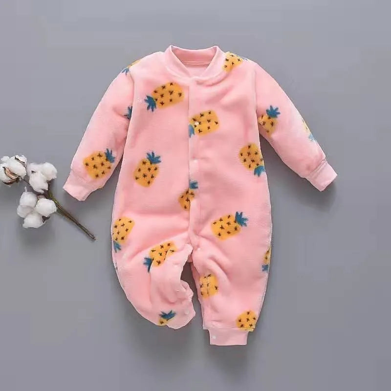 Baby wearing a long sleeve flannel romper with a printed panda pattern in pink and blue.