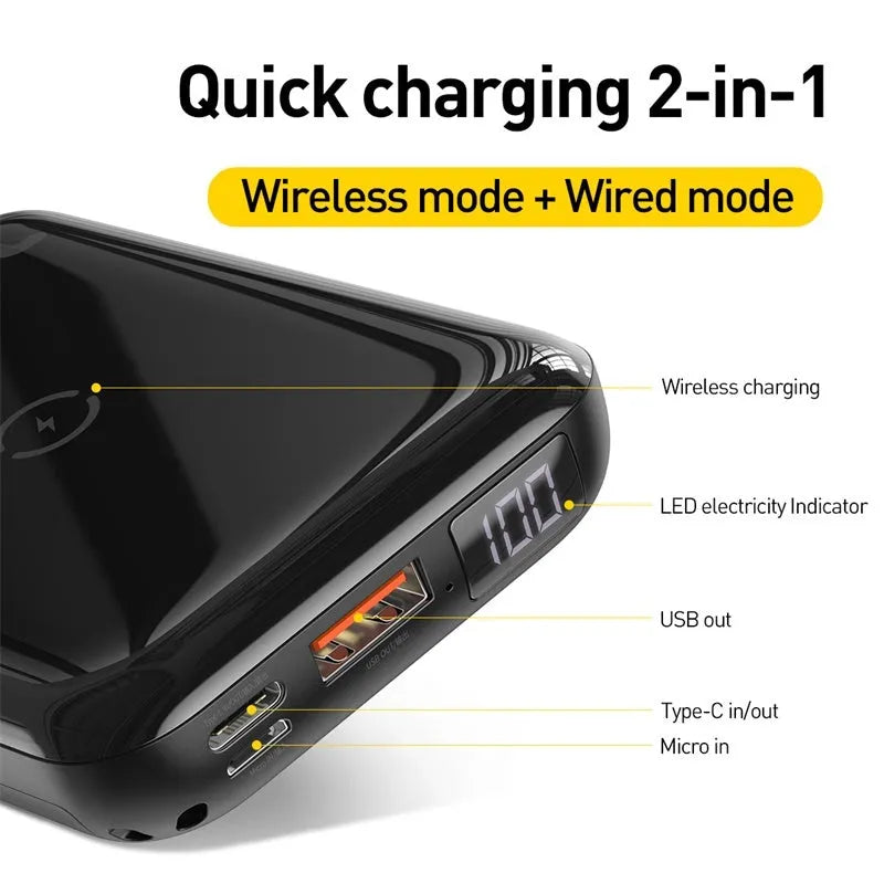 Small square black portable power bank with wireless charging surface and digital LED display.