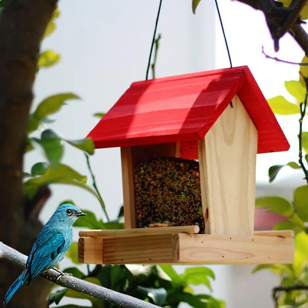 Suspended pine wood bird feeder with a red roof and log texture.