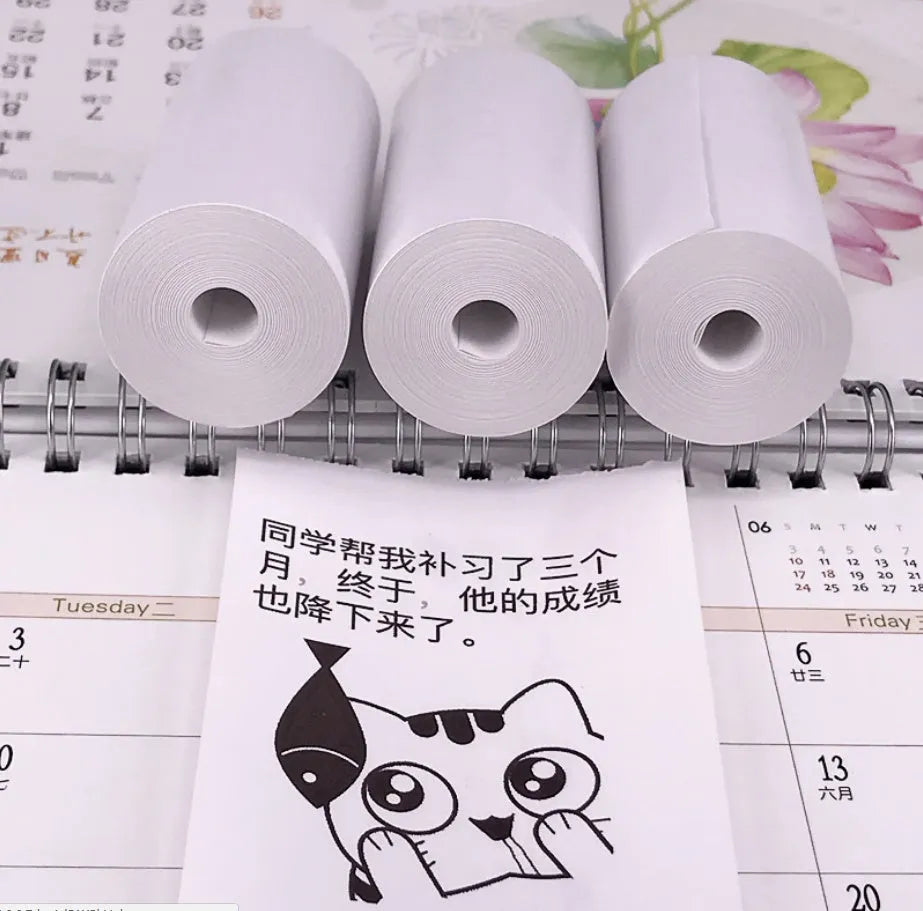 PerPage mini wireless portable thermal printer paper roll in multiple colours, showing label and sticker options