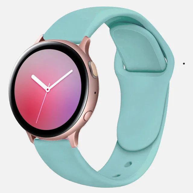 Samsung Galaxy Active 2 watch with a purple reverse buckle silicone strap on a wrist.