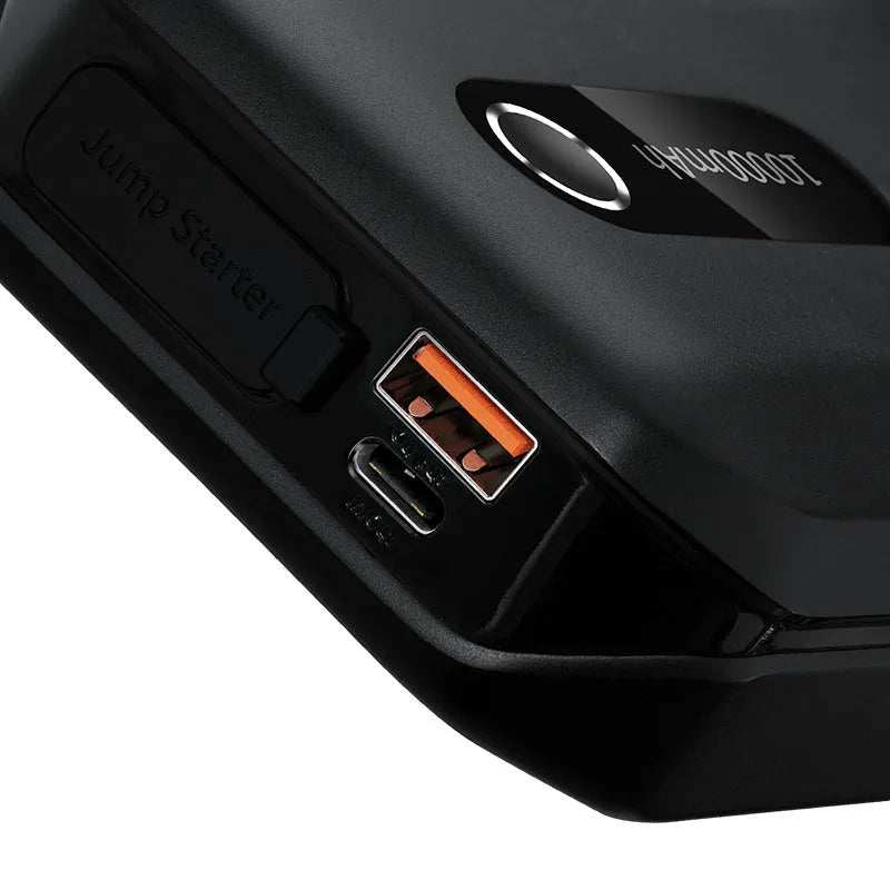 Black vehicle mounted emergency lighter jump starter with 10000mAh capacity and USB output