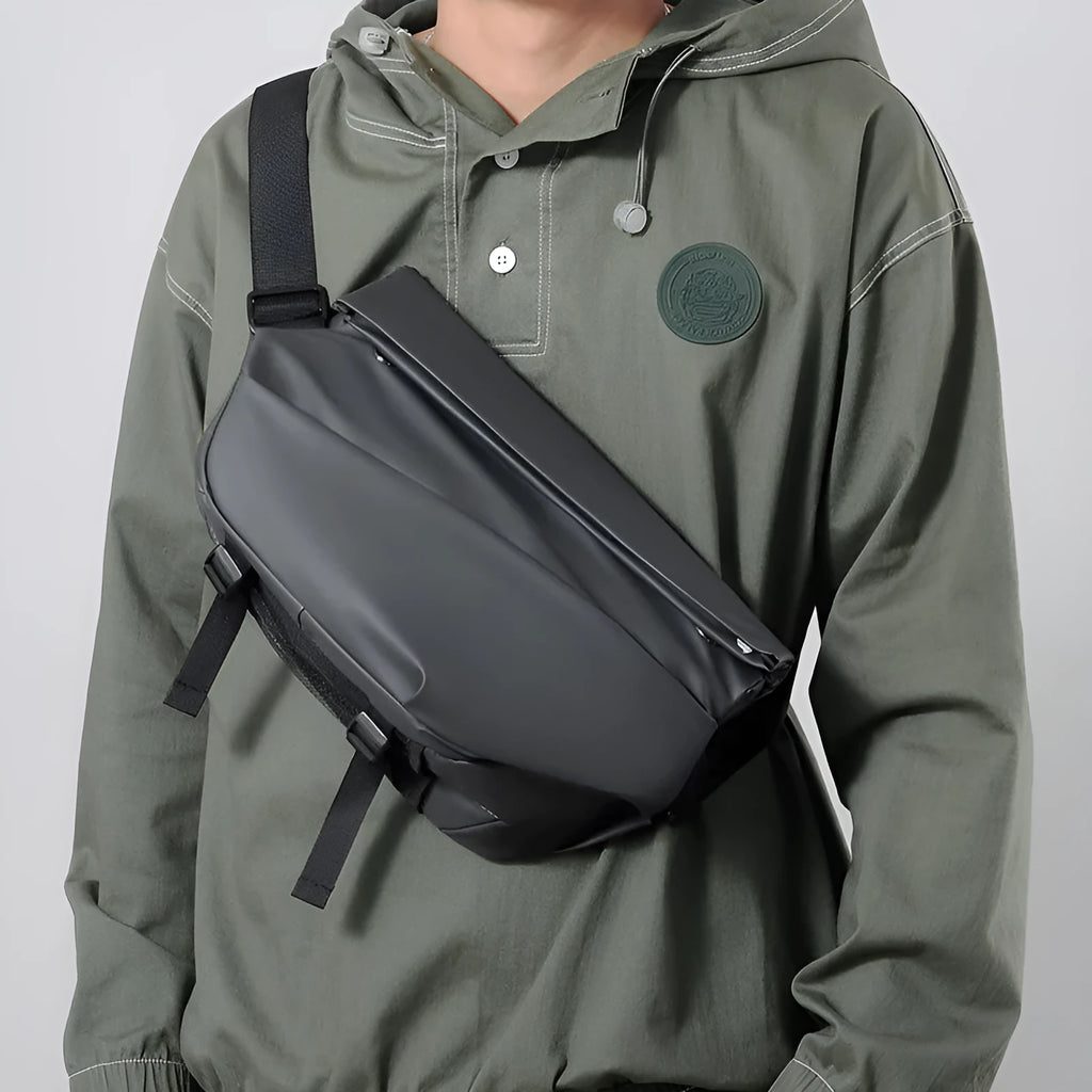 Grey men's medium PU leather crossbody sling bag with zipper and shoulder strap.