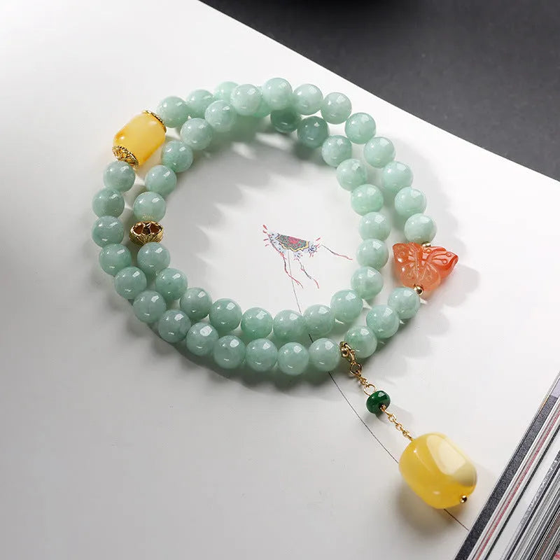Double-layer jade and beeswax bracelet with hanging barrel beads and retro geometry design