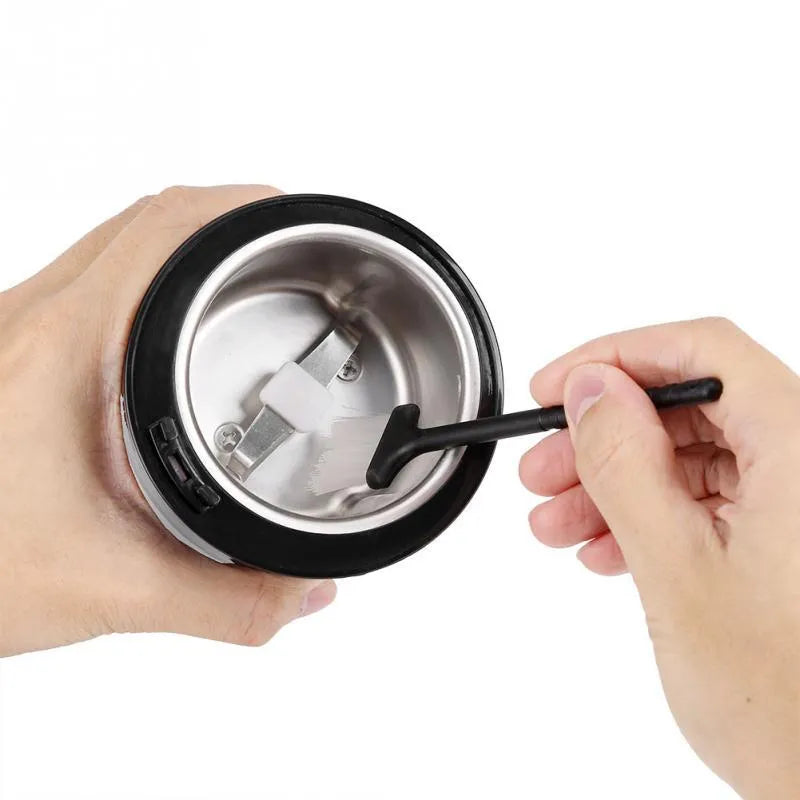 Black mini electric grinder with stainless steel liner and 400W motor for coffee beans and spices