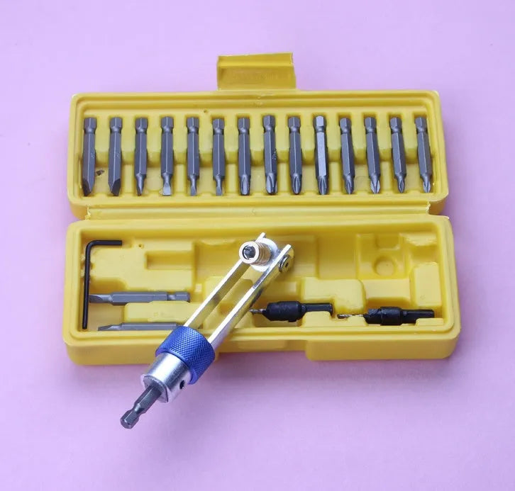 Half Time Drill adapter kit with swivel head driver, Phillips bits, flathead bits, and countersink bits on a workbench
