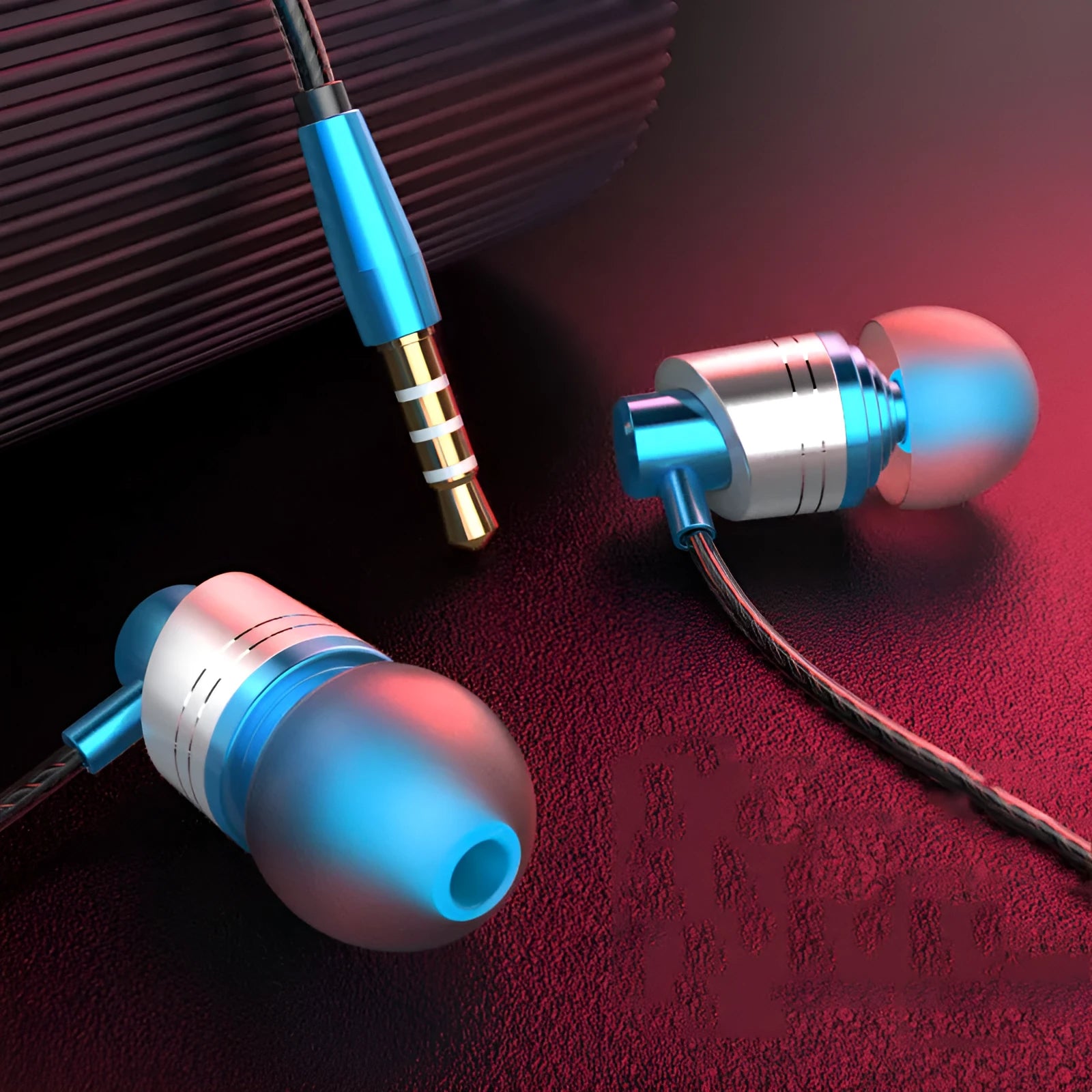 Black wired in-ear headphones with a 3.5mm plug, microphone on the cable, and silicone ear tips.