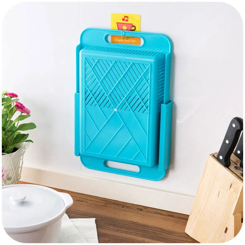 Blue kitchen chopping board with integrated drain basket for vegetable and meat preparation