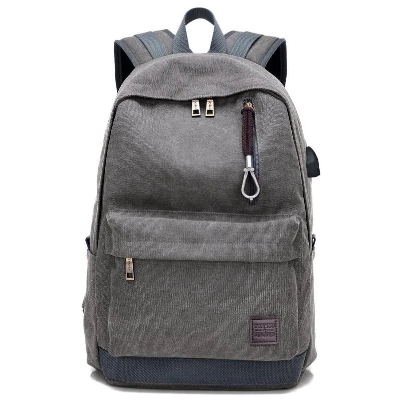 Canvas backpack with USB charging port shown in grey colour, featuring multiple pockets and straps.