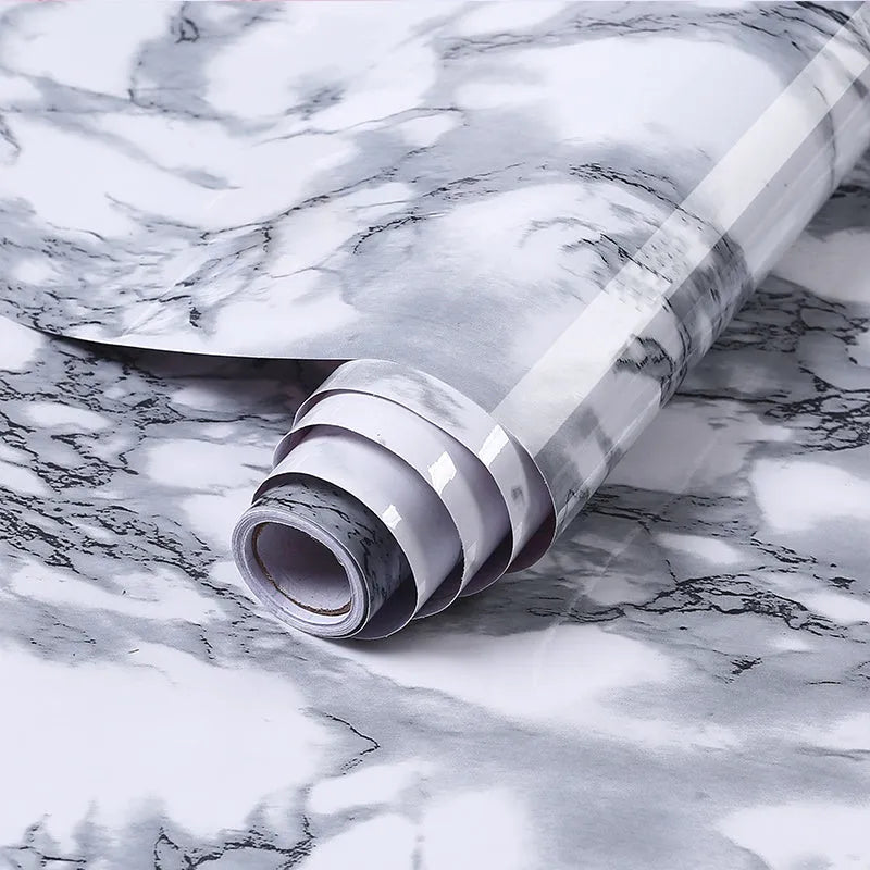 Roll of marble pattern waterproof PVC vinyl sticker for kitchen splashbacks, showing two style options.