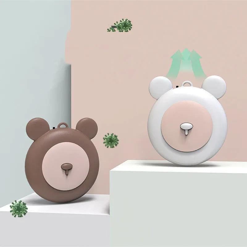Portable necklace air purifier with sterilisation function in blue colour on a desk