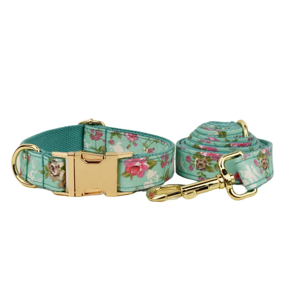 Rose pattern fabric dog collar set with green background, matching leash, detachable bow and coordinating dog vest