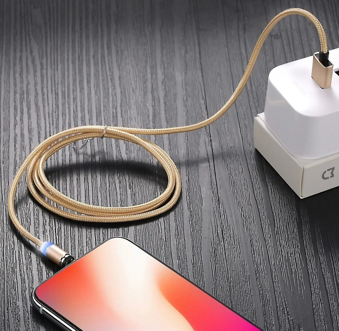 USLION magnetic data cable with aluminium ends, shown in black, connecting to a smartphone charging port.