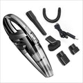 Black cordless handheld car vacuum with crevice nozzle and dust brush on grey background