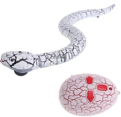 Novelty Remote Control Snake in green colour, 38 cm plastic toy with retractable tongue on a wooden floor