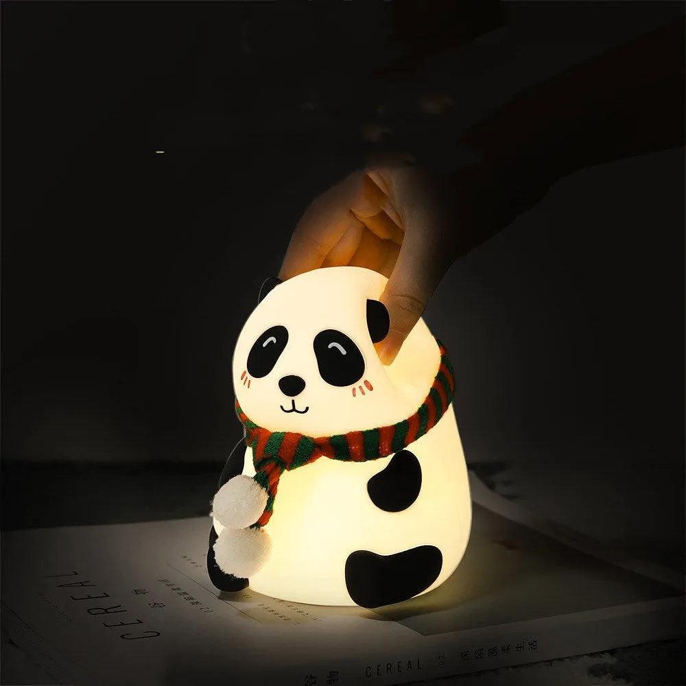 Panda-shaped silicone night light with USB charging port and compact design.
