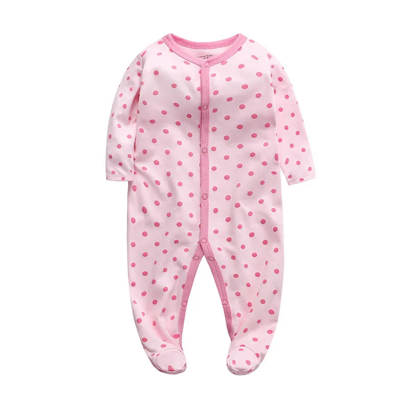 A soft cotton baby one-piece garment featuring a dinosaur print, shown on a hanger.