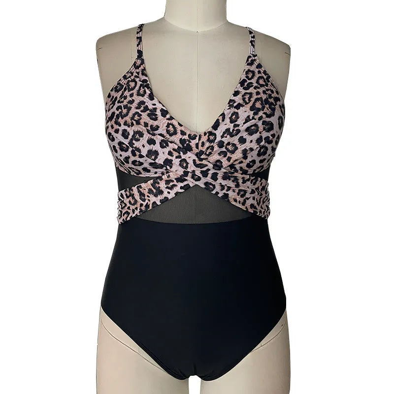 Women's mesh spliced backless one-piece swimsuit in solid black colour with polyester lining, Asian sizes S to 2XL