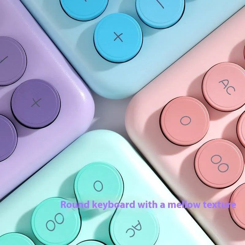 Desktop calculator with gradient colour finish in violet, cherry blossom pink, glacier blue, or mint green on a desk.