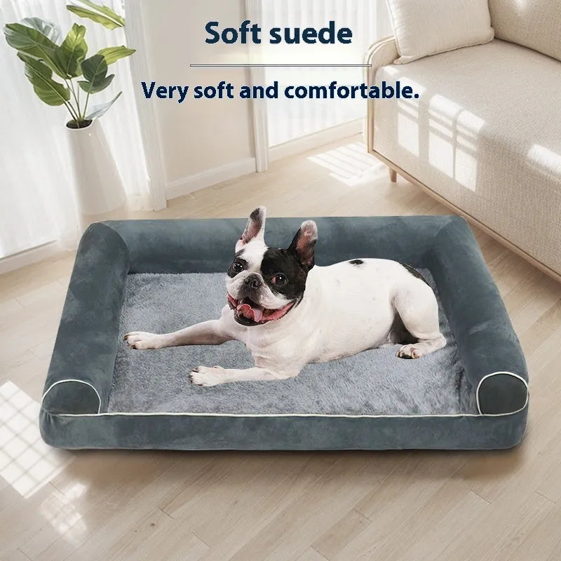 A dark grey, rectangular sponge dog bed with a removable cloth cover, shown inside a metal wire crate.