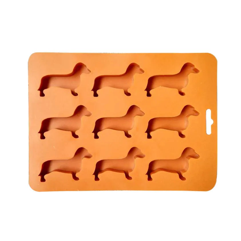 Orange silicone ice mold producing animal-shaped ice cubes for creative drinks