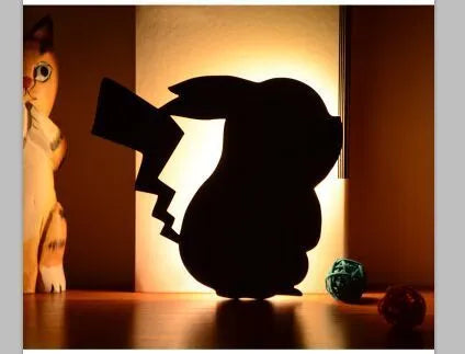 Black cartoon cat shaped LED night light with sound sensor for wall mounting.