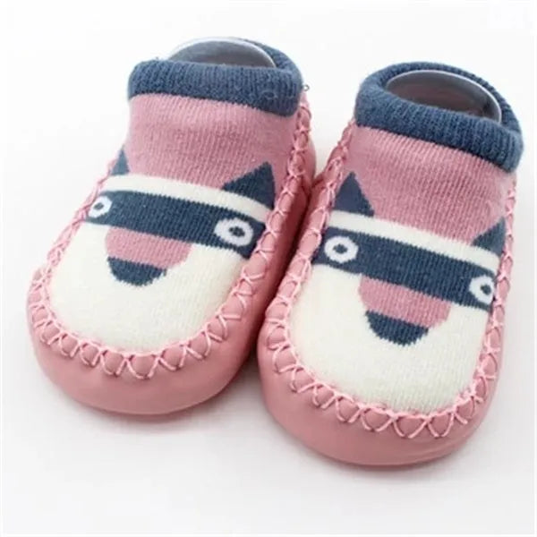 Pair of pastel coloured baby socks with anti-slip dots on the sole, shown flat.