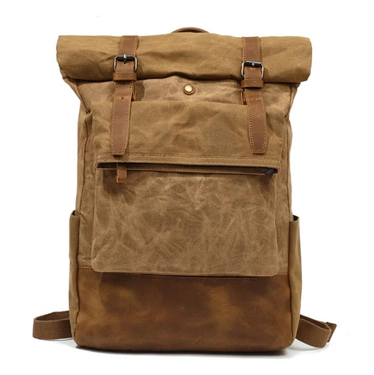 Canvas vintage backpack in khaki showing front zipper pocket and curved shoulder straps with retro square shape