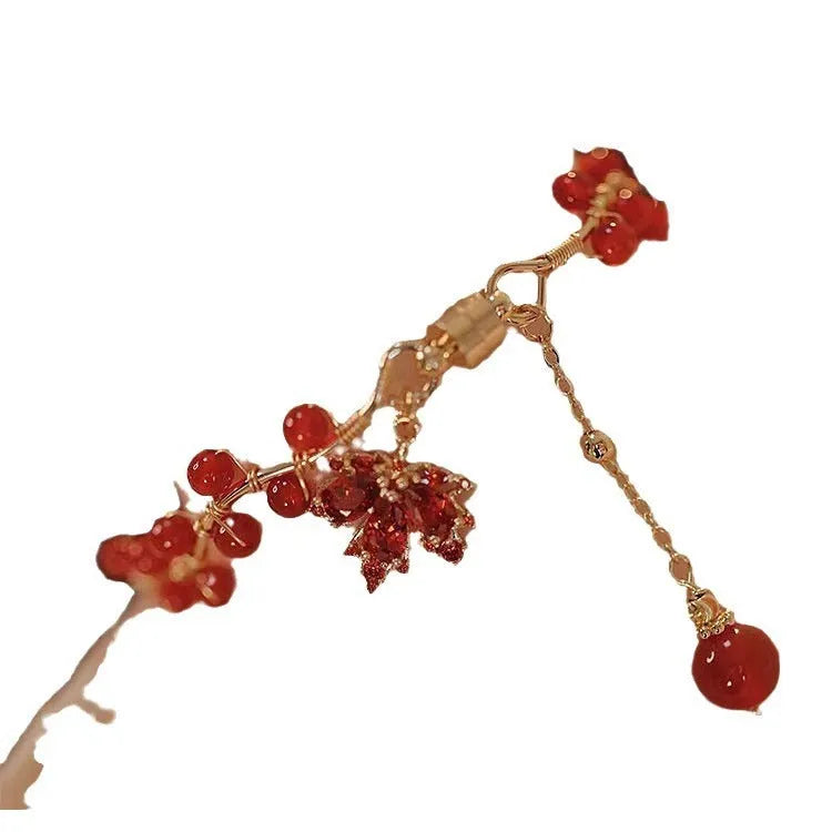 Red ginkgo leaf charm on an alloy magnetic bracelet with Chinese style design.