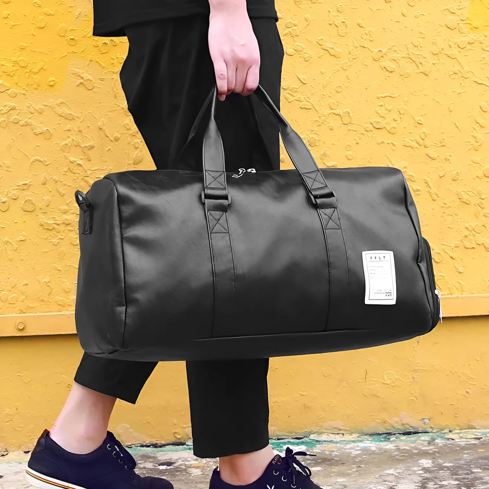 Black unisex waterproof sports bag with a separate shoe compartment and diagonal straps.