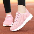 Women's running shoes in black, pink, or white with fly weaving upper and wear-resistant outsole.