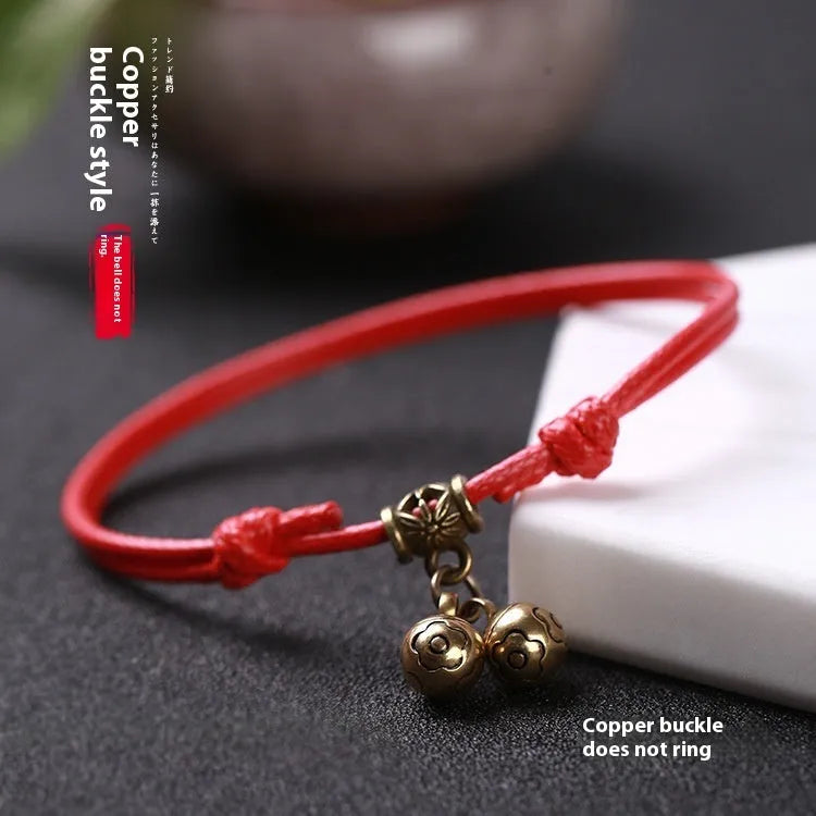 Nylon rope dog collar with brass bell shown in black, red, and coffee colours.