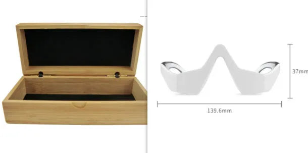 Pink and white micro-current eye massager with glasses-style design on a stand.